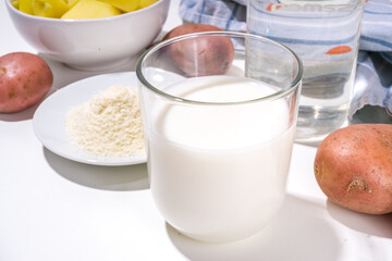 Alternative vegan potato milk, non-dairy creamy drink, with dried, raw and boiled potato 
