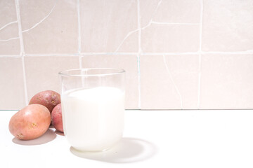 Alternative vegan potato milk, non-dairy creamy drink, with dried, raw and boiled potato 