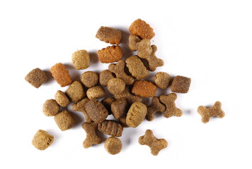 Dog food pile, dry granules for pets isolated on white background, top view