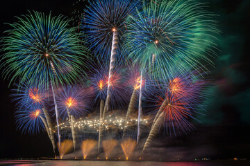 Fantastic Multicolor Firework Celebration from the big boat over the sea, celebration concept