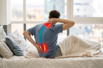 Intervertebral hernia, neck and lumbar pain, man suffering from backache at home, spinal disc...