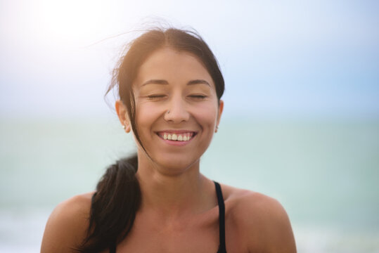 Close Up View Portrait Of Happy Young Woman With Wide And Closed Eyes. Cheerful Mood. Front View. Power Of People.