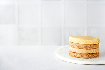 Raw meat free plant based burgers, veggie legumes patties, light background. Vegetarian food...