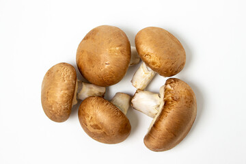 Brown champignons on a white background. Champignon variety. Healthy vegetarian food.
