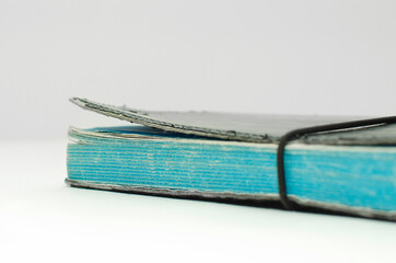 Old Tattered diarie cover with no lettering on a white background. Space for text, copy-space.