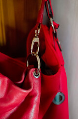 Fashionable women's red bag, close-up. Accessories for bags.