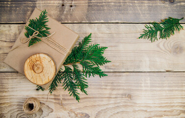 Boxes packed with kraft paper and natural twine on a wooden background.The concept of Christmas and...