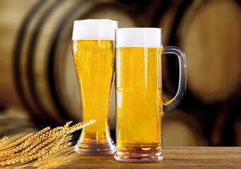 A glass of whiskey or beer with bunch of rye. Traditional alcohol distillery concept