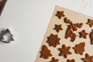 Pattern of Christmas gingerbread cookies in the form of animals, trees, snowflakes