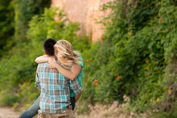 Fototapeta premium A couple Hugging Loving Pick Me Up In Love Two Together Pretty Portrait 