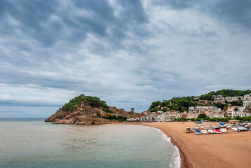 Tossa De Mar, Catalonia, Spain. A picturesque town with a fortress, with beautiful beaches and clean turquoise water in cozy bays near Barcelona. Famous tourist destination Costa Brava.