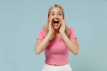 Young promoter caucasian blonde woman 20s wearing casual pink t-shirt scream shout hot news about...