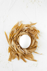 Fototapeta premium Chestnut uncooked chestnut tagliatelle. White background