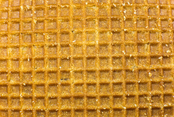 Brown Sweet Waffles or crisp cookies background texture.