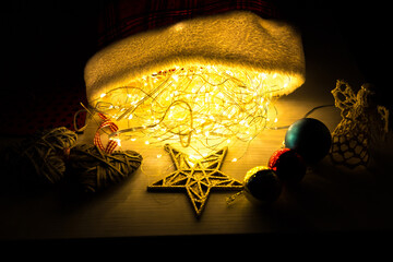 Christmas lights and garland decorations. New Year festive background. Presents, gifts, greeting...