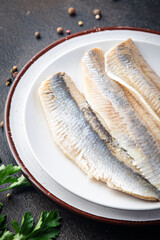 herring fish fillet Norwegian fresh seafood meal snack on the table copy space food background