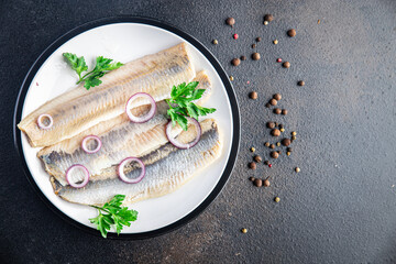 herring fish fillet Norwegian fresh seafood meal snack on the table copy space food background