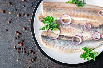 herring fish fillet Norwegian fresh seafood meal snack on the table copy space food background