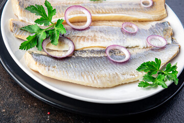 herring fish fillet Norwegian fresh seafood meal snack on the table copy space food background