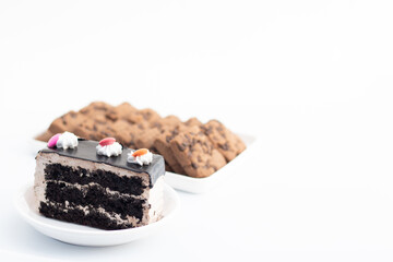 Designer Dark Chocolate Marble Pastry German Truffle With Whipped Cream Decoration On Top Served In Plate And Cookies In Blur. White Background With Copy Space For Custom Text