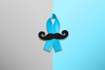 November Prostate Cancer Awareness month. Blue Ribbon with a mustache. Healthcare