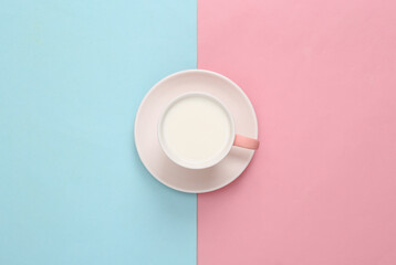 Milk cup on blue pink background