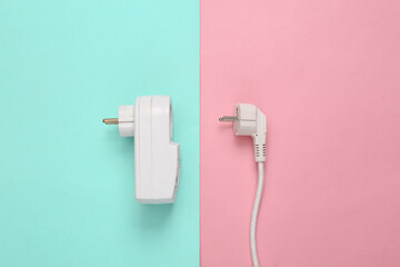 Fuse power outlet and power plug on blue pink pastel background