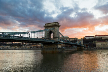 Fototapeta na wymiar A beautiful colorful sunset in front of the Danube river with the Budapest Chain Bridge as the protagonist