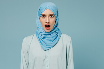 Young disappointed frowning sad displeased arabian asian muslim woman in abaya hijab look camera...
