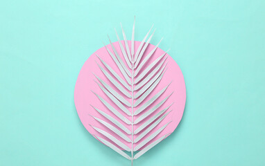 Minimal tropical layout. White palm leaf on pink circle, turquoise background