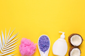 Set of bath accessories on yellow background. Top view. Copy space