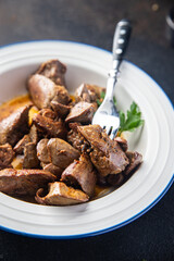 chicken liver food fried or stewed offal meal snack on the table copy space background rustic. top view 