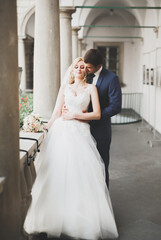 Naklejka premium Gorgeous wedding couple walking in the old city of Lviv
