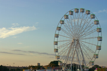 Sunset with the Ferris wheel at the fair.