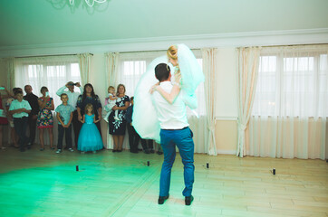First wedding dance of newlywed couple in restaurant