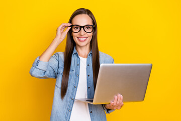 Photo of mature woman eyewear agent coach training use laptop presentation isolated over yellow color background.