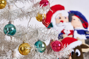 Christmas season, Christmas parties ,. Christmas tree with colored spheres and white luminous background.