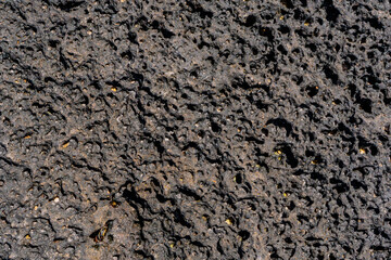 Black volcanic stone macro closeup. High quality photo