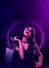 Black friday sale concept. Shopping woman holding grey bag isolated on neon background in holiday