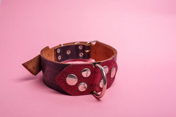red and black leather necklace with rivets and a ring