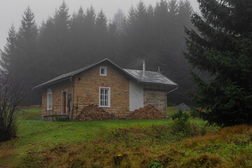 Railroad old house near Jedlova station in Luzicke mountains in autumn morning