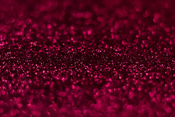 Pink sparkling glitter bokeh background, christmas abstract defocused texture. Holiday lights
