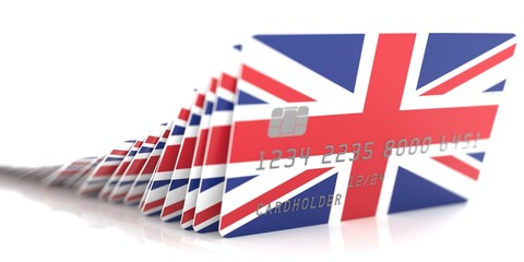 Line of fallen credit cards with flags of the UK on white background, 3d rendering