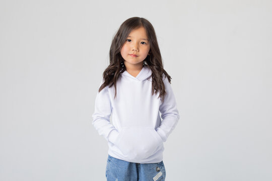 Cute asian girl in white blank hoodie. Mock-up.