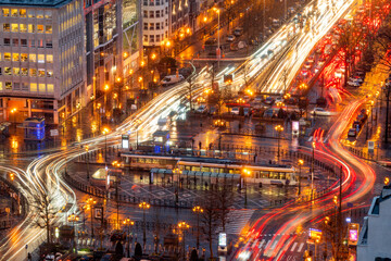 Brussels, Belgium with traffic along Boulevard de Waterloo at night. - obrazy, fototapety, plakaty