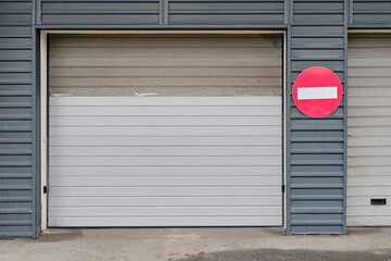 Garage doors repaired after the accident, repainted lifting doors for the entry of cars