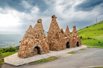 Monument near the road, dedicated to ancient cave dwellings carved out of soft volcanic tuff rocks, that is the main attraction of Goris town in Armenia.