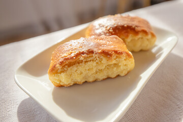 Delicious and sweet pastries on a plate with morning light from the window
