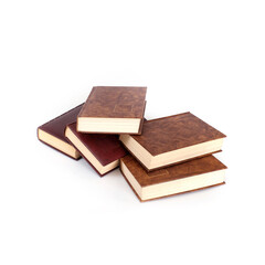 Stack of books in brown covers isolated on a white background