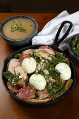 Poached turkey, a classic dish of Bahian cuisine with turkey meat, vegetables, bananas, eggs and sausage